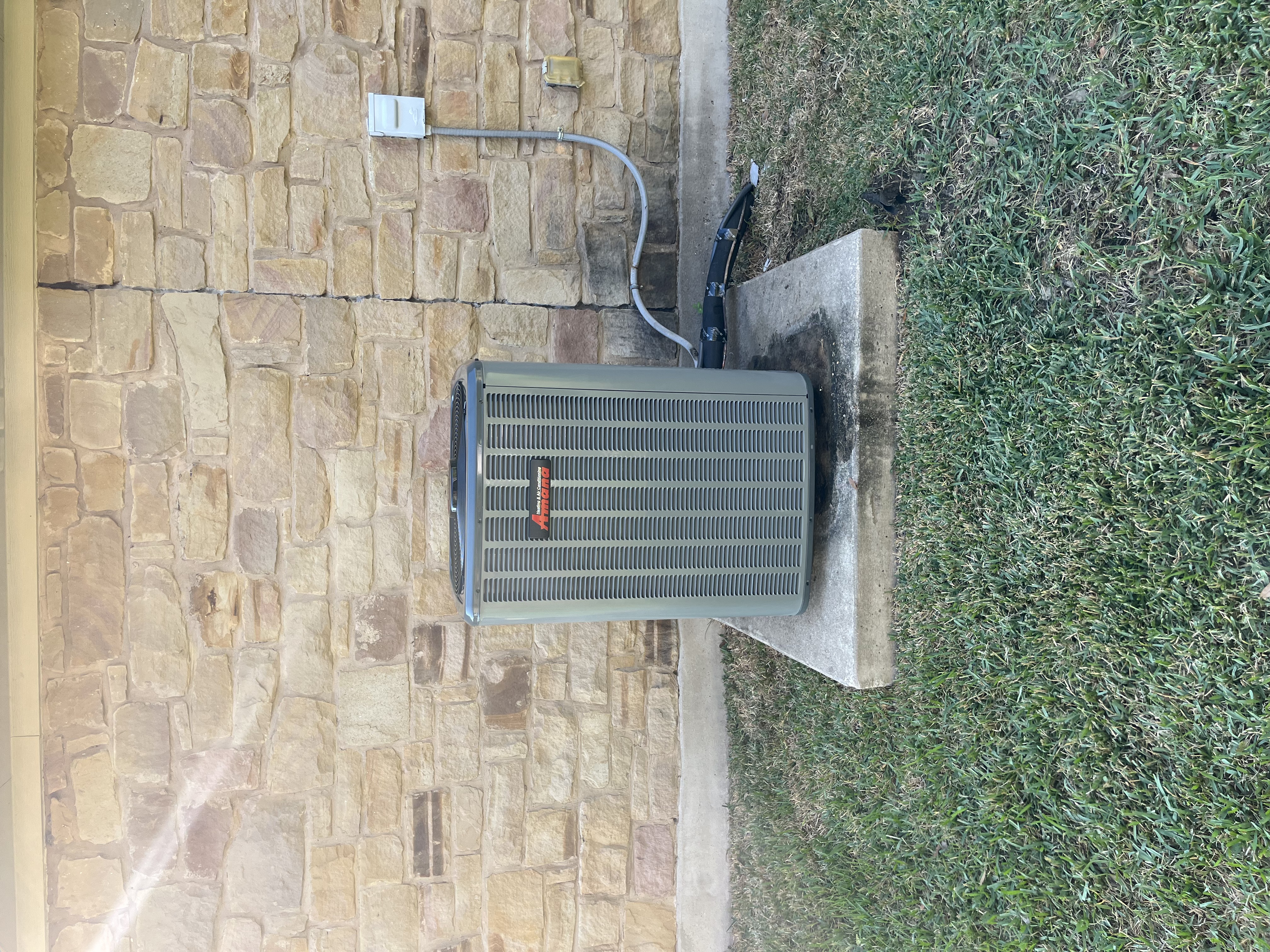 Outdoor AC condenser unit installation